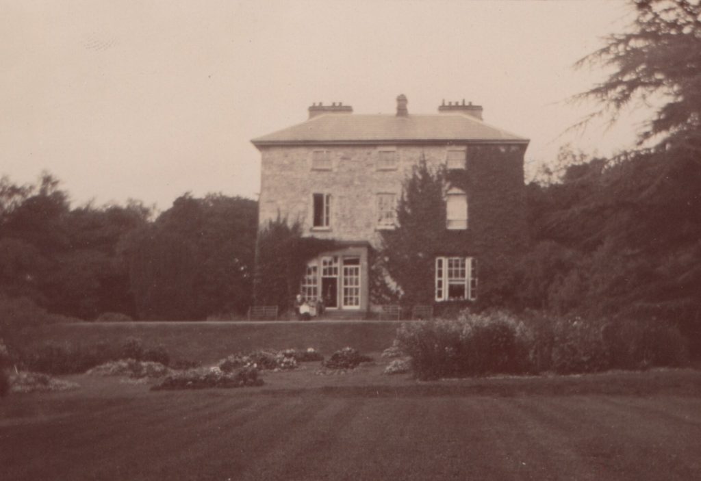 cropped south elevation from gardens Corravahan B&W c.1910 with HKL & family